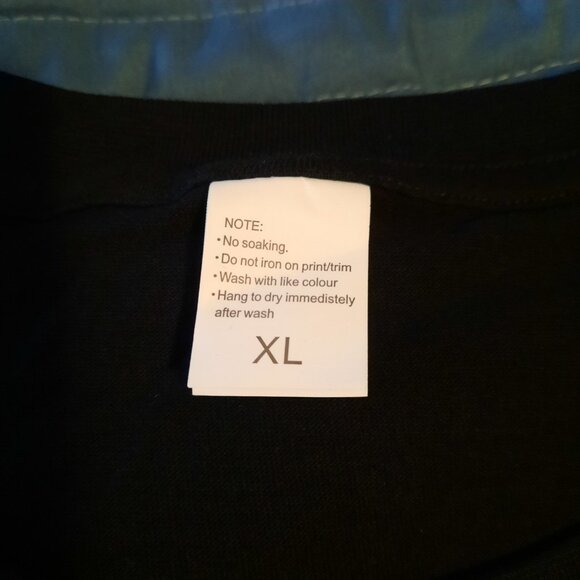 New Christmas T-Shirt Most Likely To Cause Some Drama Black Funny T-Shirt - Picture 3 of 4